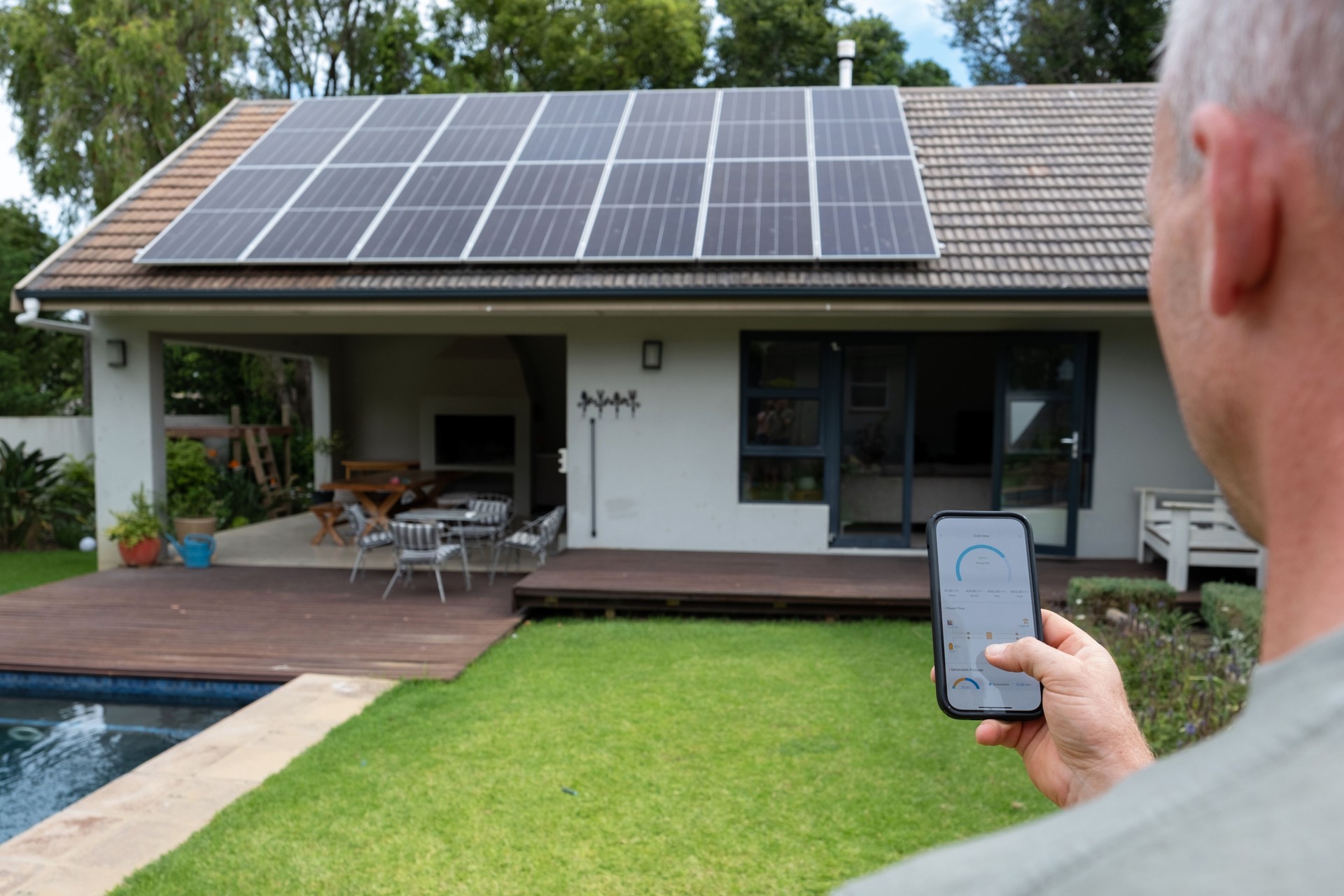 Man monitoring his solar system from mobile phone